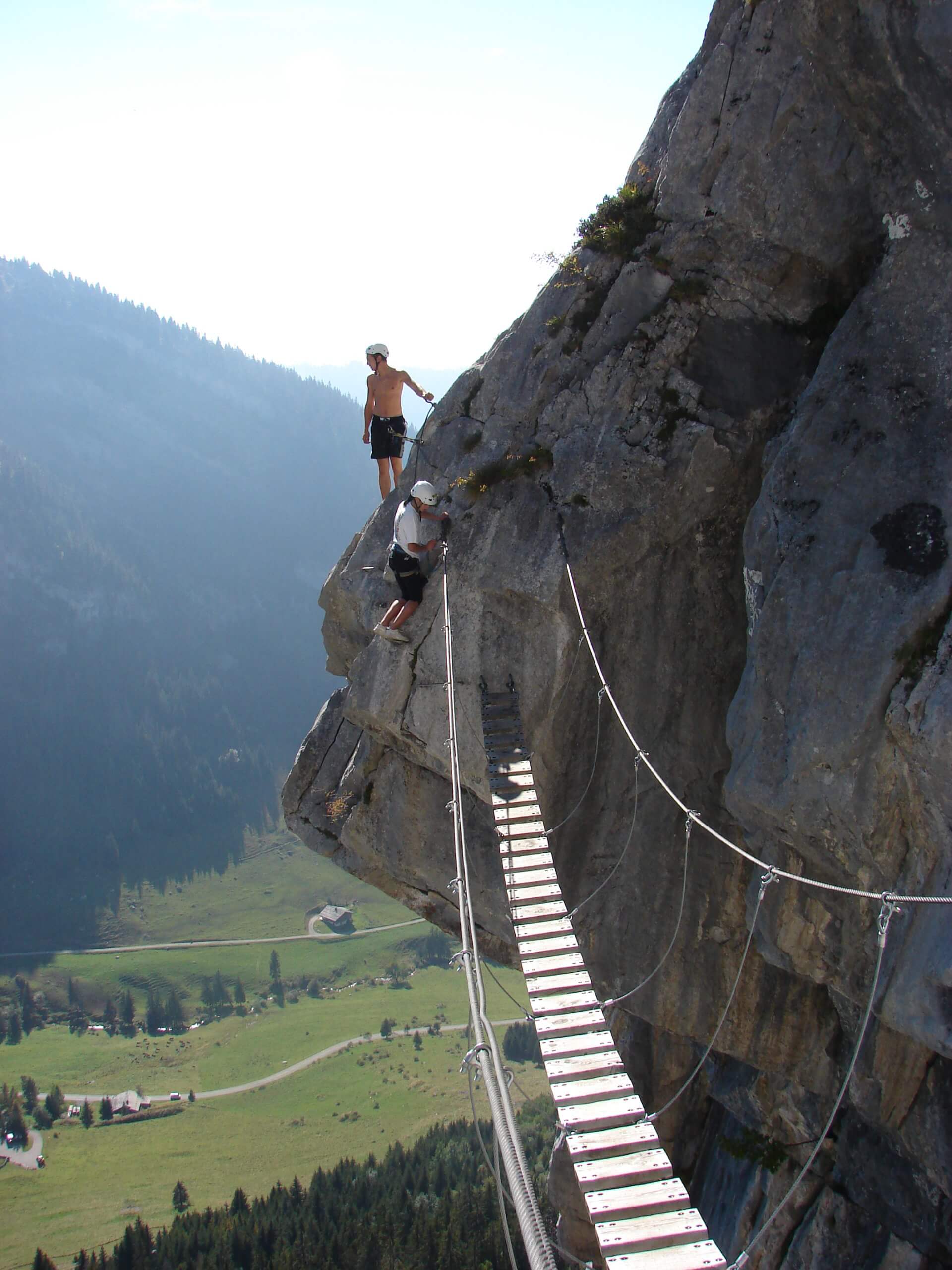 people on bridge Via Ferrata course