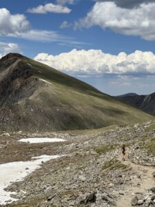 Woman running toward Torrey's peak